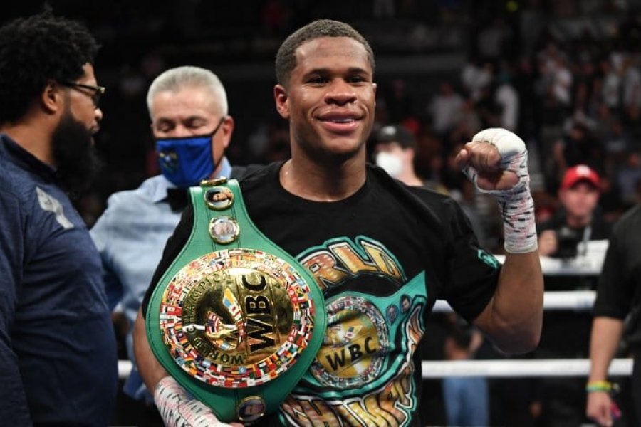 Devin Haney celebrates victory.